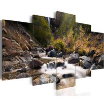 Canvas-taulu Artgeist A waterfall in the middle of wild nature, eri kokoja