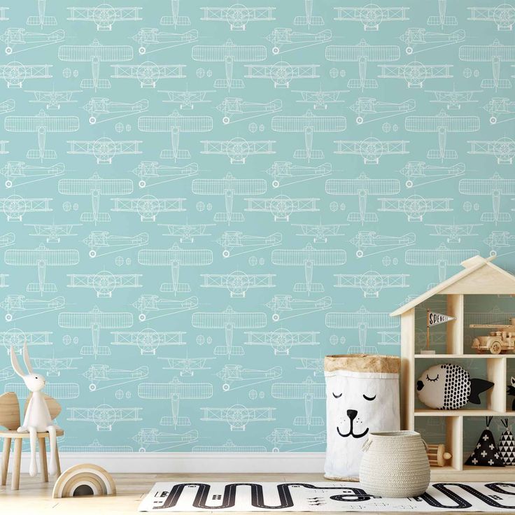 Tapetti - Sketch - Outline of an airplane in white on a turquoise background.